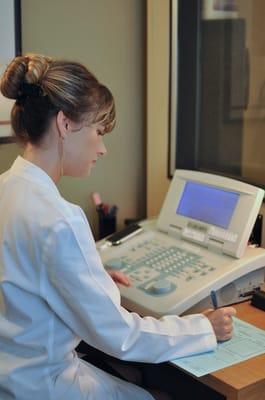 Audiologist, Dr. Poindexter, Testing Hearing