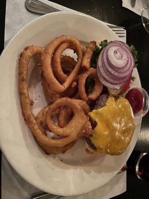 Burger with cheddar cheese, and a side of onion rings, Patty was tender, but tasteless.