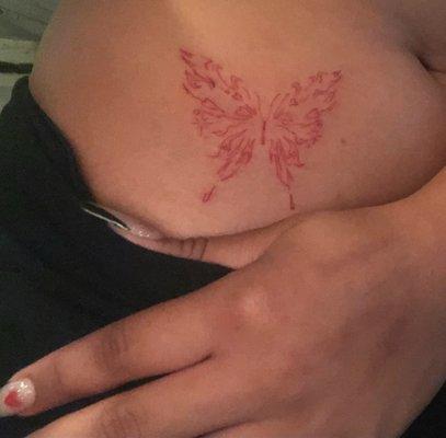 Red butterfly tattoo