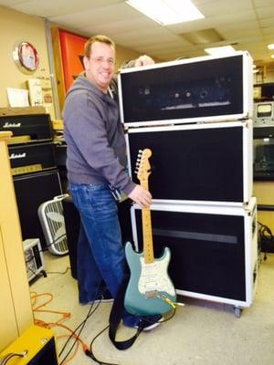 George Lilly with his stack of custom made cabs.  He has an open back and a closed back made here at the shop.