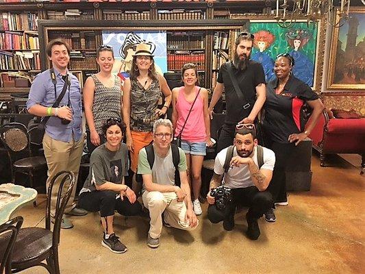 Happy group of international tour guests enjoying Little Havana walking tour and tasting