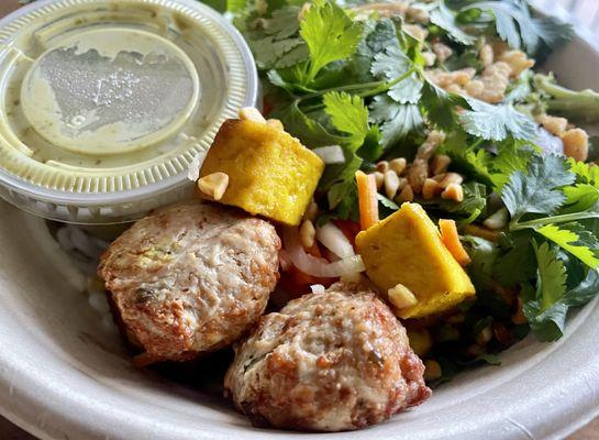 Build Your Own (kind of) with Chicken meatballs with some tofu pieces, carrot, daikon, cilantro etc. with green curry sauce on the side