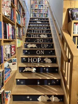 Stairs to upstairs children's area - cute and creative stair art!