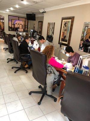 Busy at nails salon but work fast due to number of nails technician