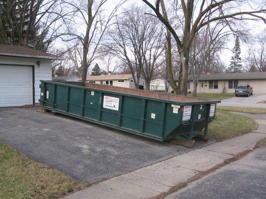 20 yard dumpster in driveway.