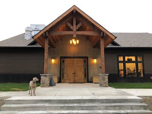 The entrance to our new Clubhouse!  With Gretchen showing it off!