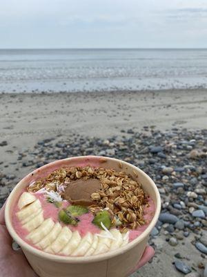 MAMBO smoothie bowl: pitaya, banana, strawberry, & mango smoothie topped with fresh banana, kiwi, coconut and homemade granola.