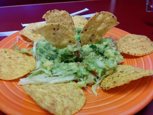 Partially eaten guacamole salad. Very tasty.