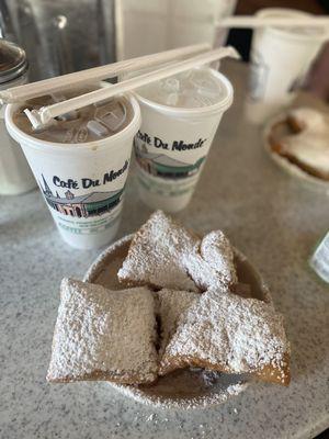 Iced cafe au lait with beignets