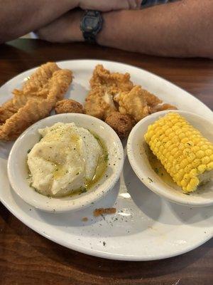 Fried grouper and fried catfish, garlic mashed potatoes and corn on the cob