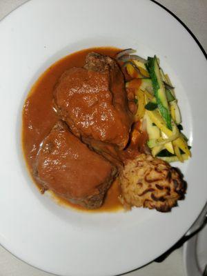 Guinness Short Ribs served with potato puree and demi glaze.