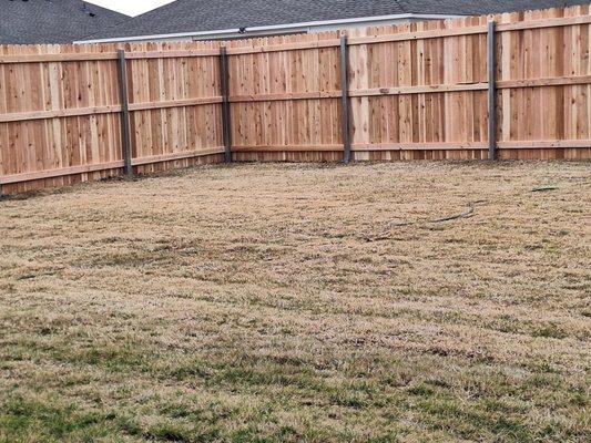 New fence steel posts and all natural wood pickets and crossbars.