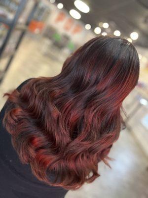 Cherry cola red dimensional hair color beach waves style