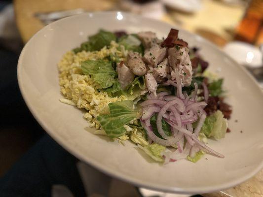 Cobb salad, no tomato, add onion. Dry with blue cheese on the side