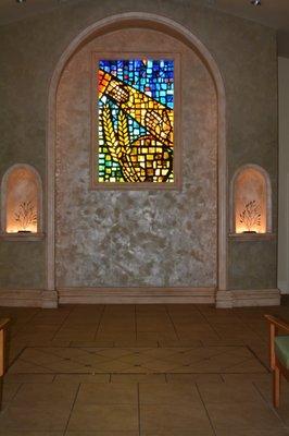 Stained glass in the front of chapel.