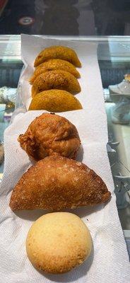 Beef empanadas, chicken empanadas, papa rellena, cheese empanada, and pan de bono