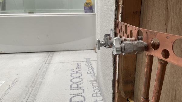 Cement backer board over plywood floor.