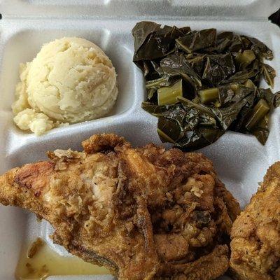 Fried chicken, gravyless mashed potatoes and collard greens