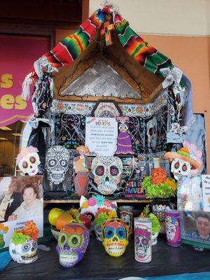 Mi Tienda has an altar outside its store dedicated to employees who have lost a loved one.