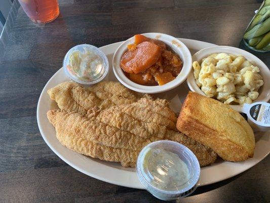 Catfish fillet, macaroni & cheese, candy yams, and there cornbread and a side of coleslaw and tartar sauce