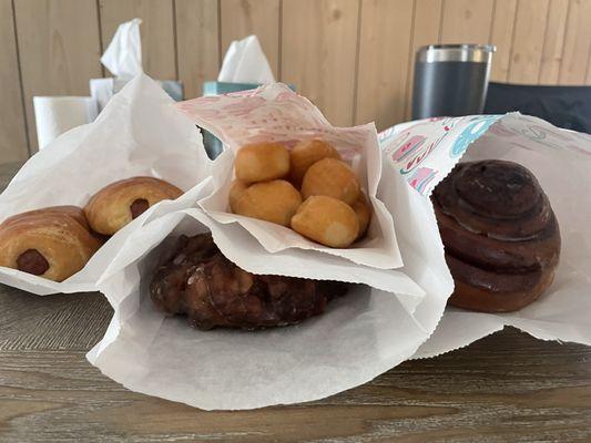 Kolaches, donut holes, cinnamon roll, apple fritter