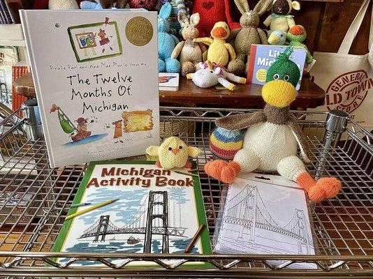 We carry a variety of books and hand-knit toys for kids!