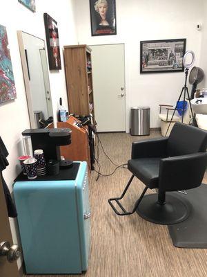 Her drink station and her hair cutting chair.