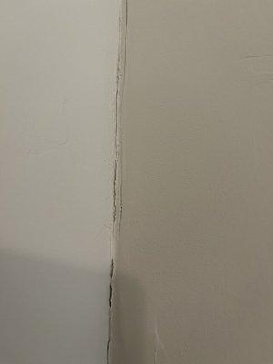 Cracked wall in guest bedroom