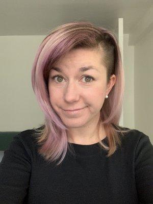 Pink/purple hair with a shaved side haircut