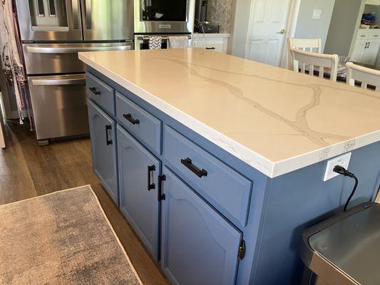 My kitchen island was painted a different color (Smoky Blue by Sherwin-Williams) to the rest of the kitchen cabinets to add a pop of color.