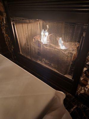 Seated next to the fireplace. Nice touch