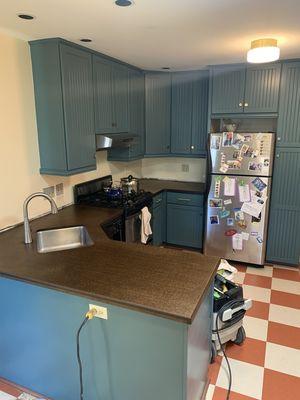 Kitchen refinish. All cabinets repainted.