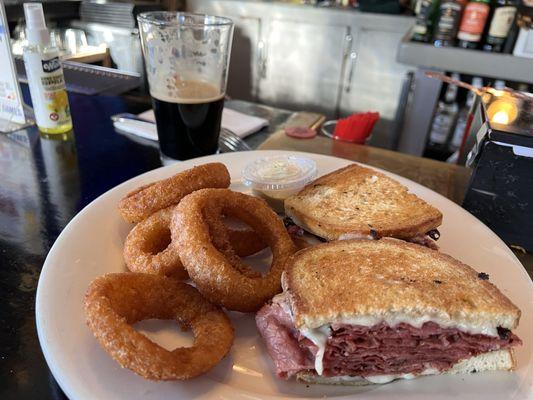 Pastrami sandwich with a side of wonderful onion rings and deli mustard. That's a Founders Vanilla Porter in the background.