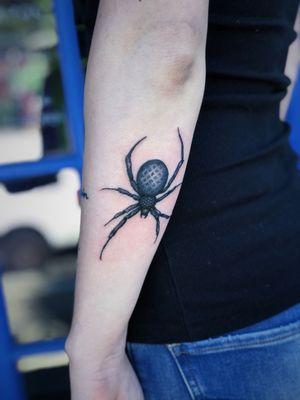 Creepy realistic blue toned spider tattoo