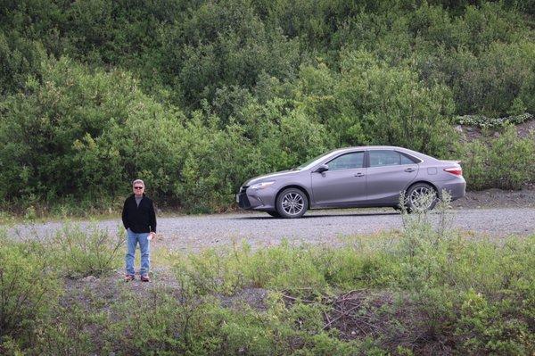 Dad with our rental car in the background