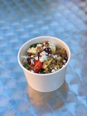 Quinoa Salad:Tri-color quinoa, zucchini, grape tomatoes, spinach, cranberries, candied walnuts, goat cheese, and lemon vinaigrette w/ lavash