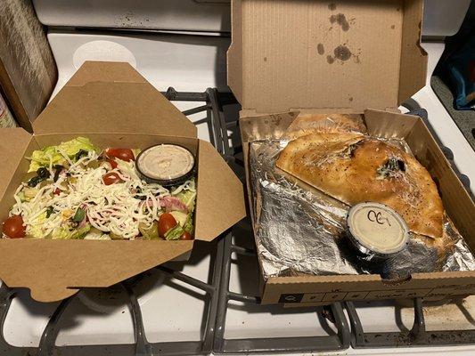 Large Italian salad and veggie calzone