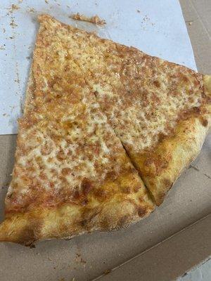 Regular slice, very nice thin crust, perfect amounts of cheese and sauce.