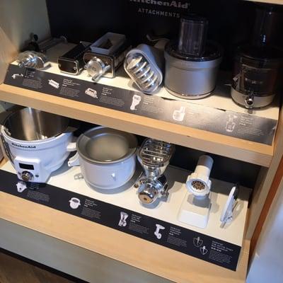 Lineup of all the cool Kitchenaid stand mixer accessories right underneath the mixer display