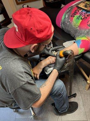 Travis, our trusted third artist doin his thing and blowing this tattoo out of the water.