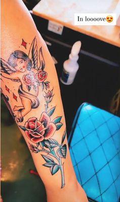 Caitlyn tattooed a cherub and a single stem rose on my arm. The result is stunning !