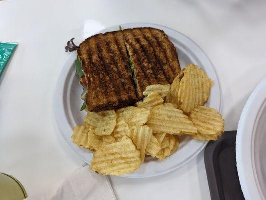 Grilled chicken panini with chipotle mayo and side of chips