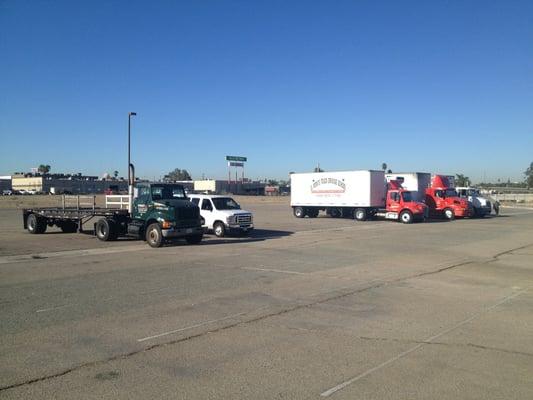 Various trucking schools waiting to take drive tests.