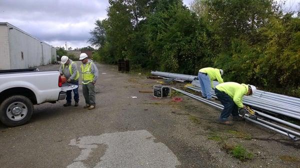 Preparing post for Holes Creek Restoration Project.