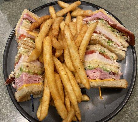 Club sandwich with fries