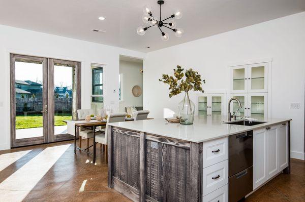 Custom Farmhouse kitchen with reclaimed sandblasted island and white shaker fronts