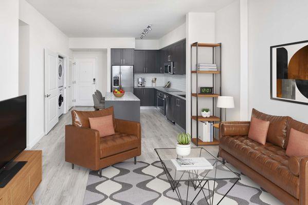 Living room and kitchen in Da Vinci floor plan at Camden Central high-rise apartments in St. Petersburg, FL