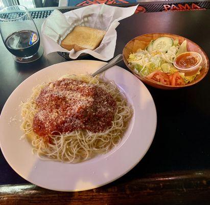 Spaghetti and meatballs with salad and garlic bread.