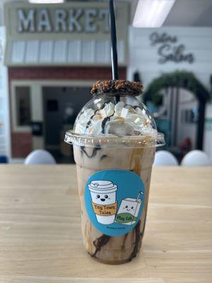 Secret menu: Samoa Mocha; dark chocolate, caramel, coconut iced latte with a fun Samoa girl scout cookie on top!