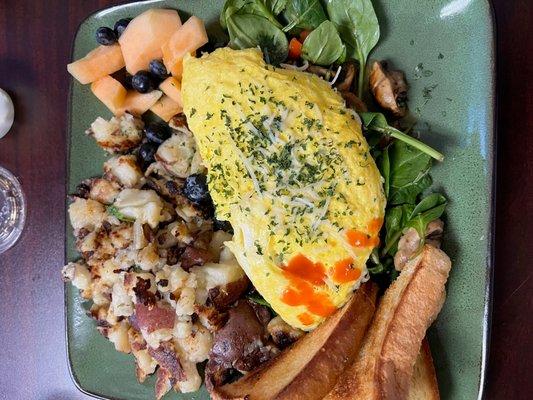 Omelet with fried potatoes, fruit and toast- huge portions!